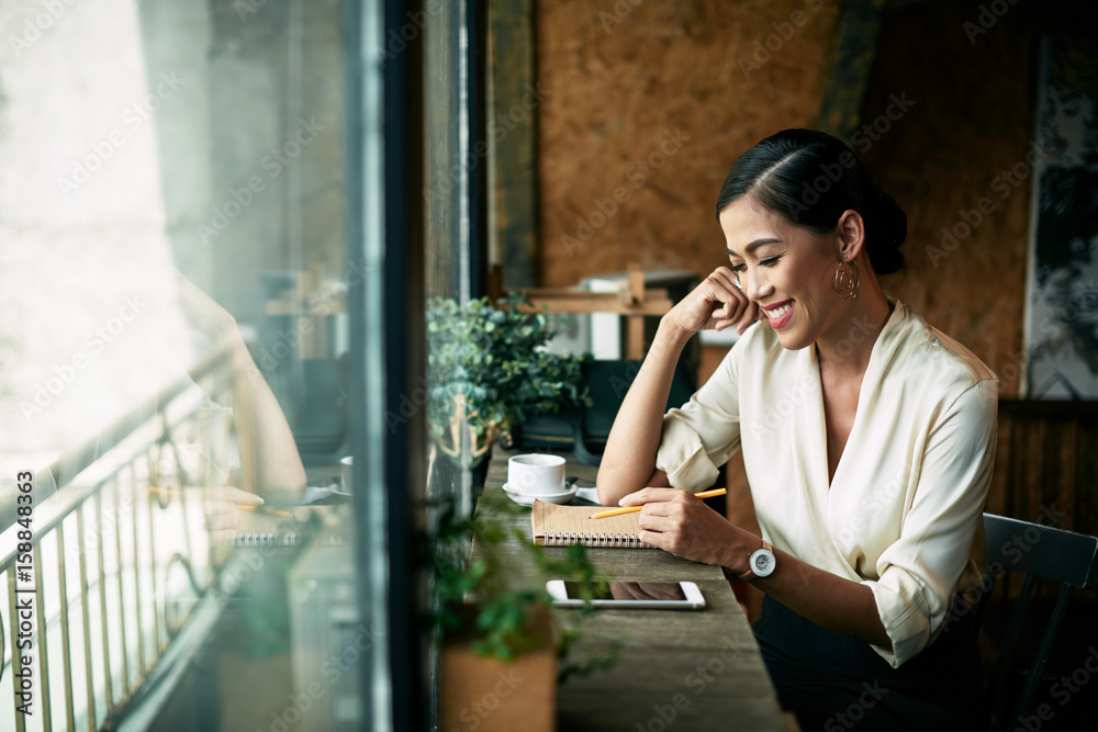 Fototapeta premium Beautiful woman in cafe