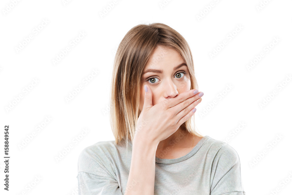 Pretty young girl covering her mouth with hand Pretty young girl covering her mouth with hand