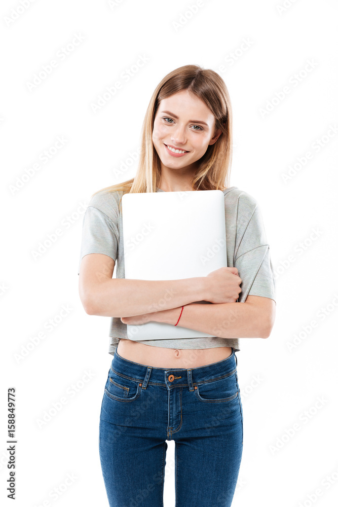 Young woman holding laptop computer Young woman holding laptop computer