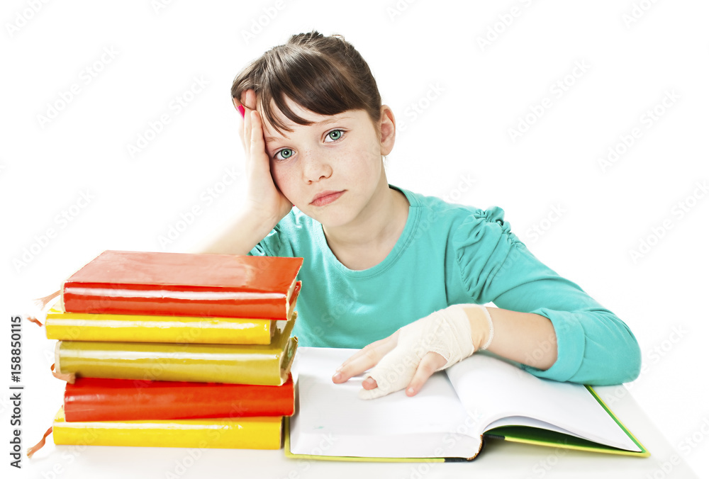 Child with broken arm in classroom, studio shoot. Isolated on white background Child with broken arm in classroom, studio shoot. Isolated on white background