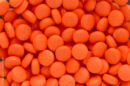 Texture of orange pills