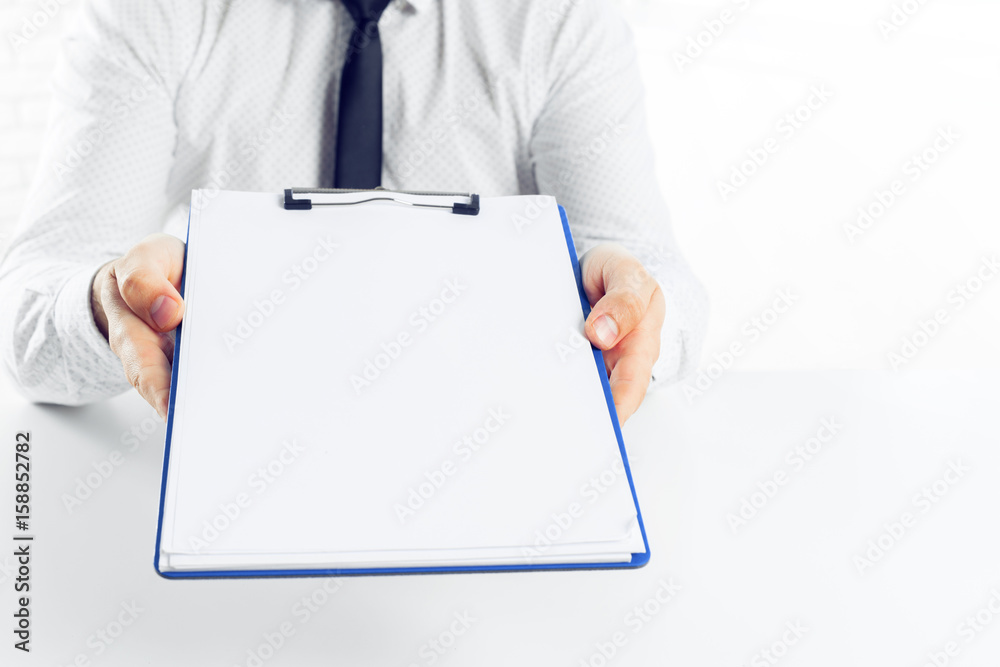 Clipboard on a white table. close up Clipboard on a white table. close up