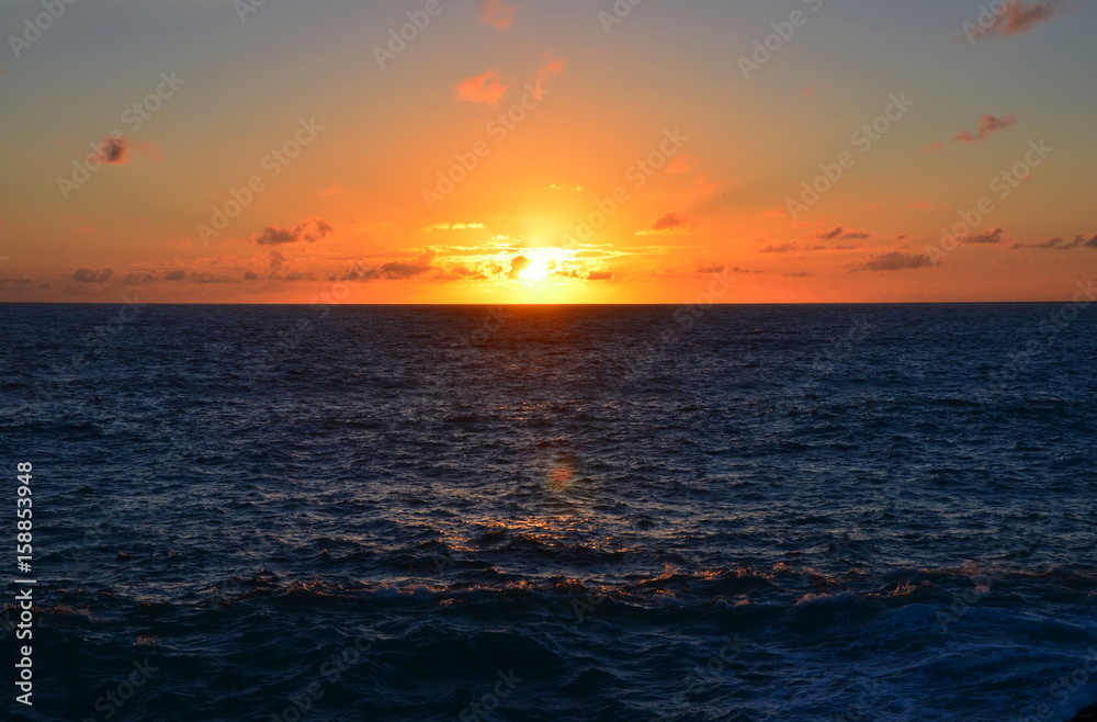 Obraz premium Beautiful Sunset at West Coast of Algarve between Praia do Amado and Cabo de Sao Vincente