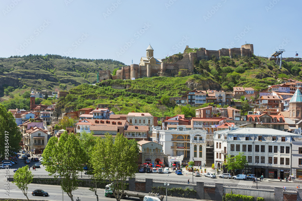 Naklejka premium Panorama view of Tbilisi, capital of Georgia country. Old part of city with Narikala fortress on the hill.
