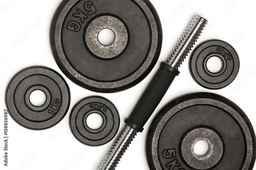 Top view of heavy weight plates with iron bar isolated on white Top view of heavy weight plates with iron bar isolated on white