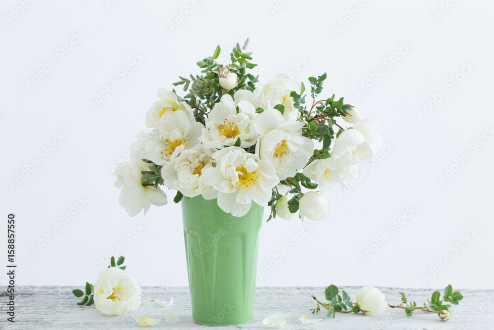 white roses in vase