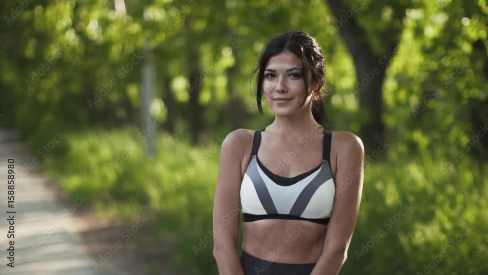 portrait of a beautiful young girl athletes. model in sportswear posing for camera and smiling. portrait of a beautiful young girl athletes. model in sportswear posing for camera and smiling.