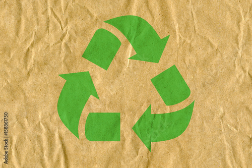 symbol for refuse reuse recycle with cardboard background photo