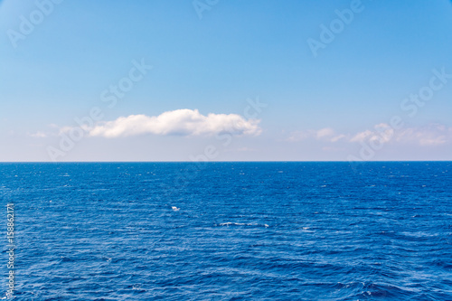 Beautiful blue sea and subtle clouds during cruise © Tomasz Czajkowski