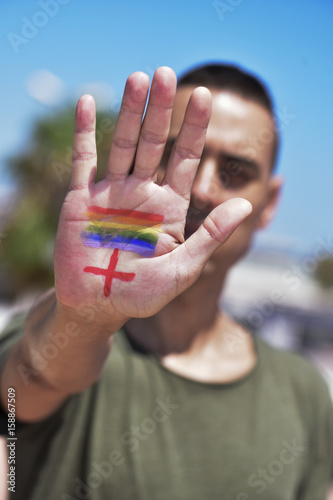 rainbow flag and plus sign, for LGBTI HIV-positive people