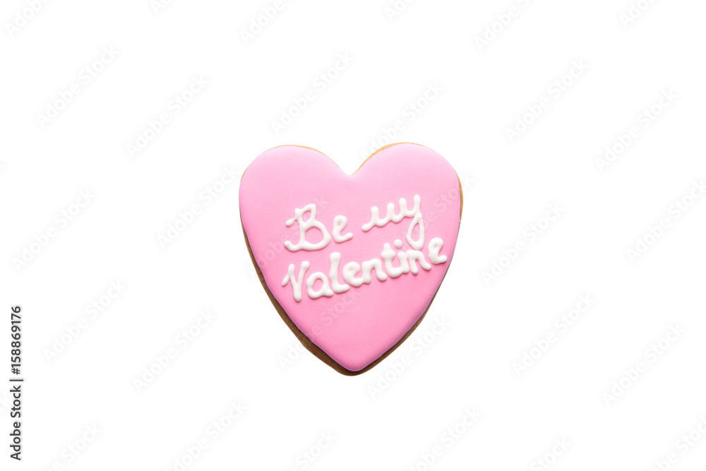 Gingerbread cookie with pink icing and be my Valentine inscription isolated on white