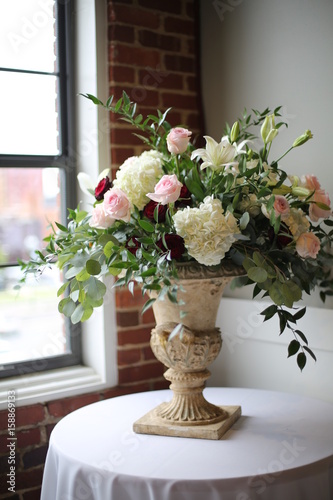 Large Beautiful Floral Arrangement in a Room with Exposed Brick Walls