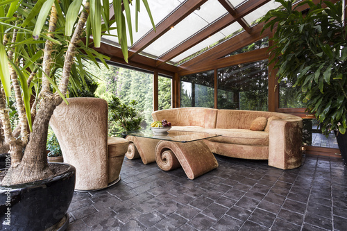 Stylish orangery with potted plants photo