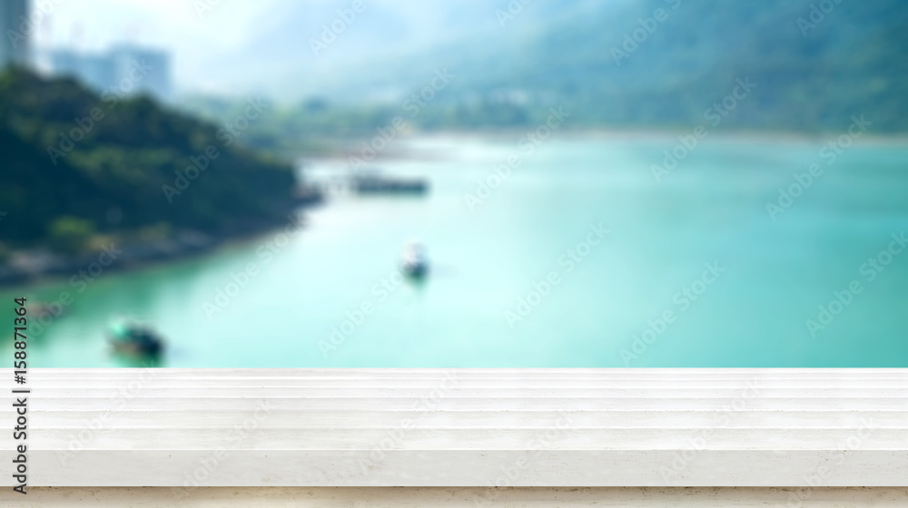 Empty white wood plank table top with blur ocean and mountain,Mock up for display or montage of product,Banner or header for advertise on social media,Summer background
