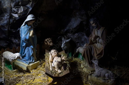 Child Jesus lying in manger in cave