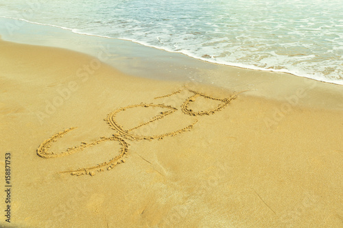 The word  sea  written on the sand