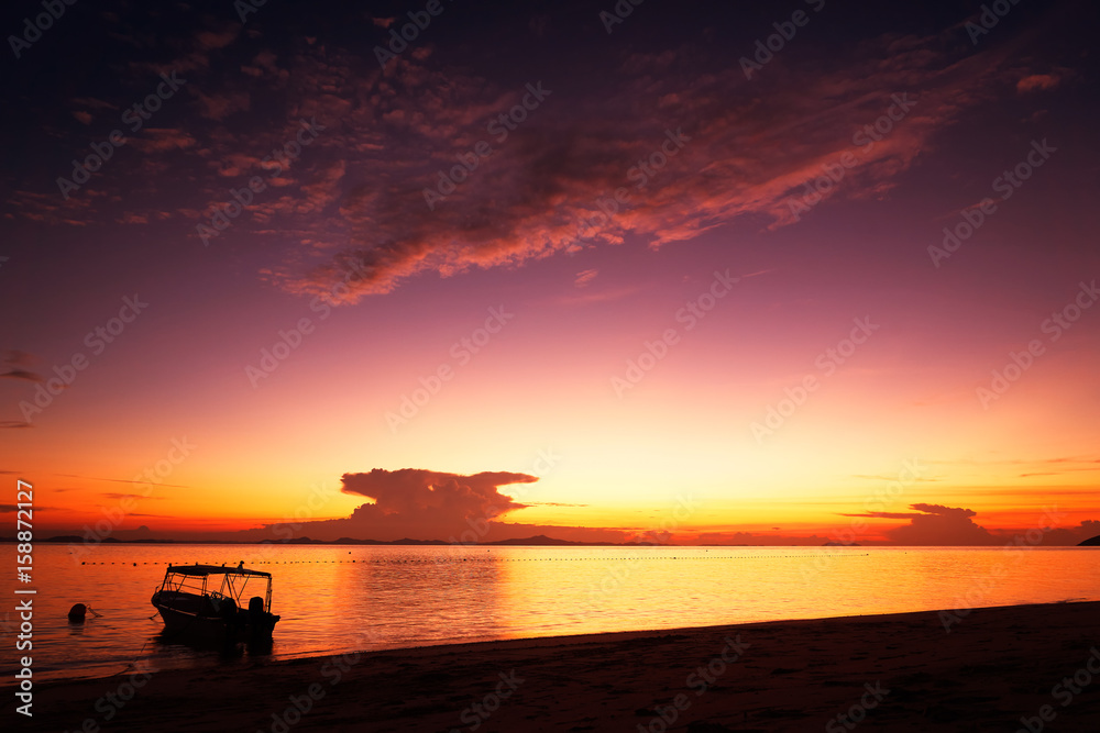 Golden dawn over the beach .Rawa island , Malaysia . Selected focus on center .