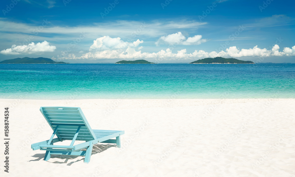 Beach tropical with relaxing chair ,white sandy and crystal water . Rawa island ,Malaysia .