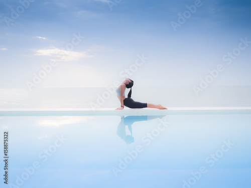 Asian woman practice yoga on the beach © chayathon2000