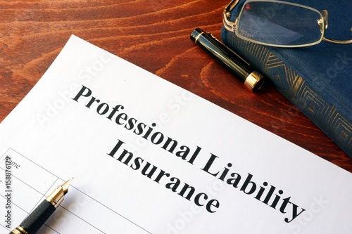 Professional liability insurance policy on a table. photo