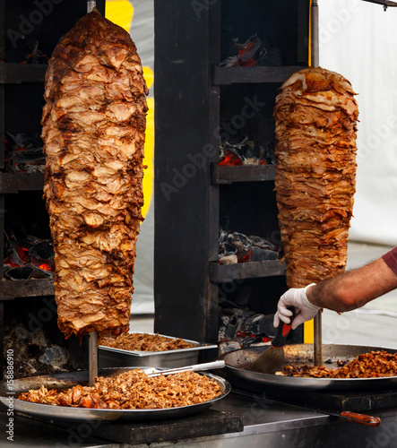 Closeup picture of stacked meat roasting, shawarma photo