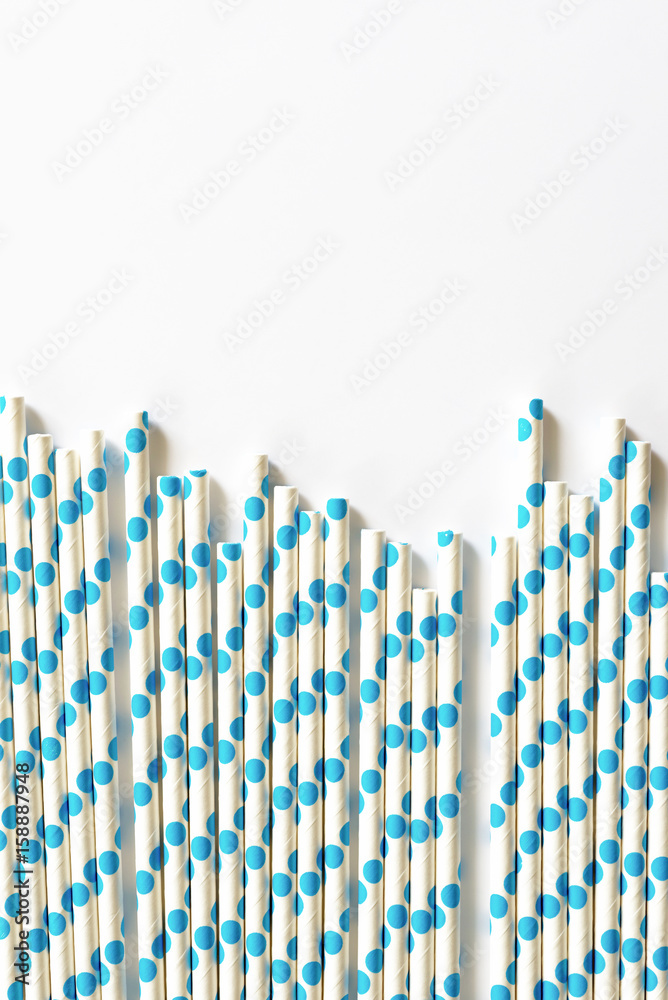 blue polkadot paper straws on white background. blue polkadot paper straws on white background.