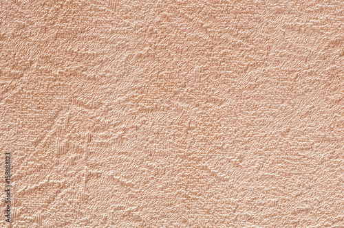 Rough abstract scratched beige-brown wall texture