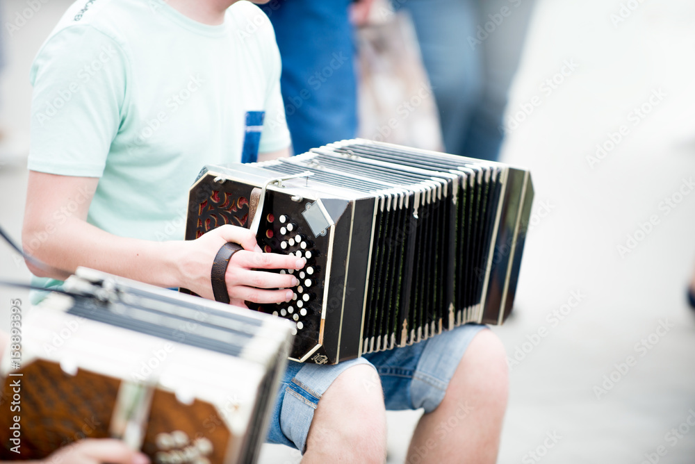 Human Hand Playing the Accordion Close Up