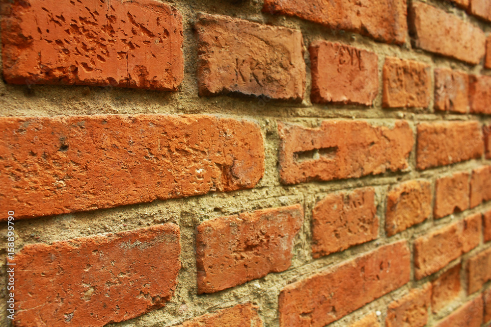 Wall of red brick. Fragment of the wall of the building built in 1937 Wall of red brick. Fragment of the wall of the building built in 1937