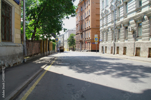 One of the small streets in the center of Moscow. Summer, weekday.