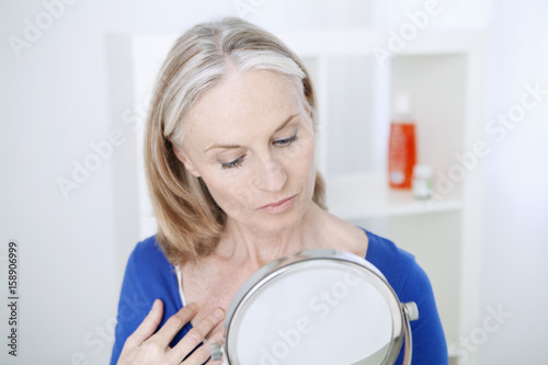 Elderly person with mirror