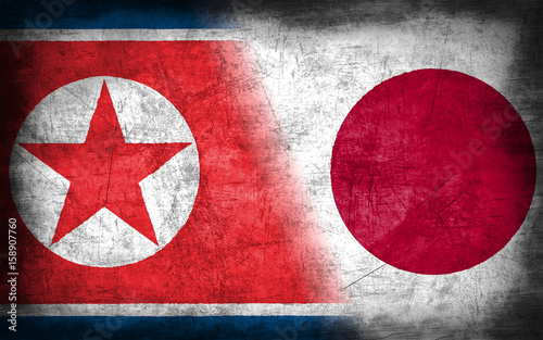 North Korea and Japan flag with grunge metal texture