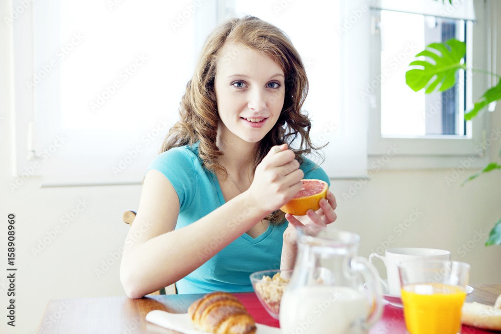 Woman eating breakfast