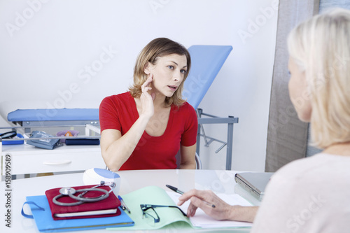 Female patient consulting for earache