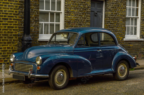 Old blue car parked on the street, old london, old building in london