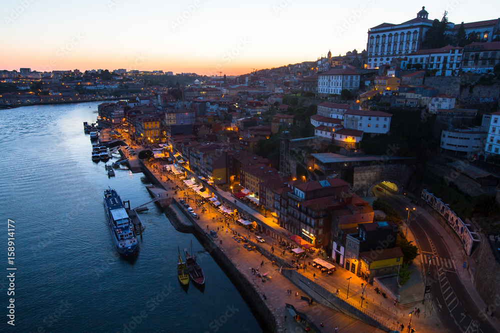 View of the Douro river and Ribeiro at night, Porto, Portugal.