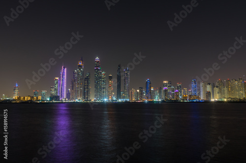 Dubai Marina night skyline from Palm Jumeirah promenade  UAE United Arab Emirates