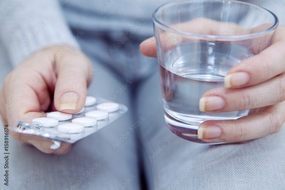 Woman taking medication Woman taking medication