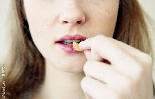 Woman eating dried fruit