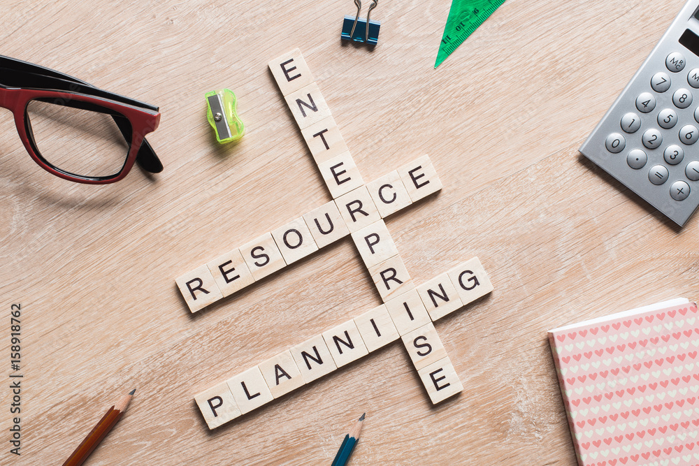 Conceptual business keywords on table with elements of game making crossword Conceptual business keywords on table with elements of game making crossword