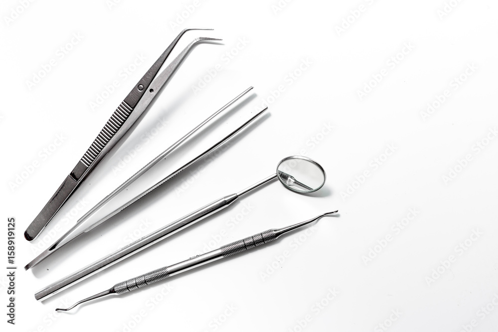 dentistry with dentist tools close up on white background top view space for text dentistry with dentist tools close up on white background top view space for text