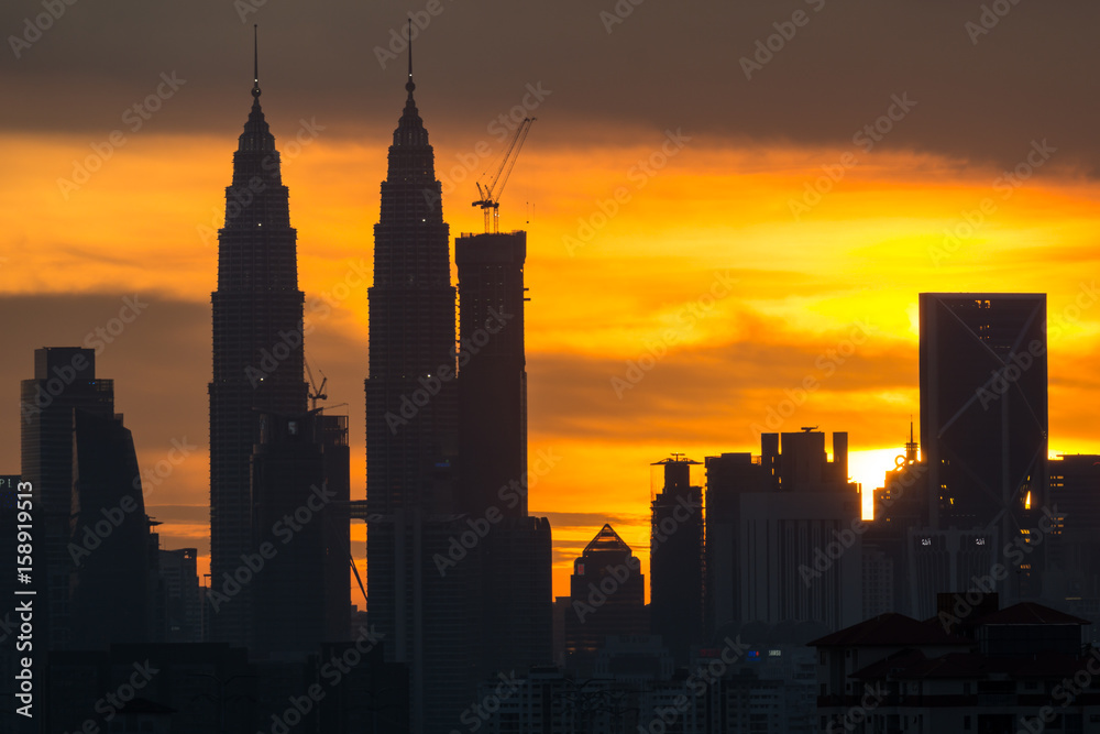 A majestic sunset in Kuala Lumpur, the capital of Malaysia. Its modern skyline is dominated by the 451m tall KLCC, a pair of glass and steel clad skyscrapers.