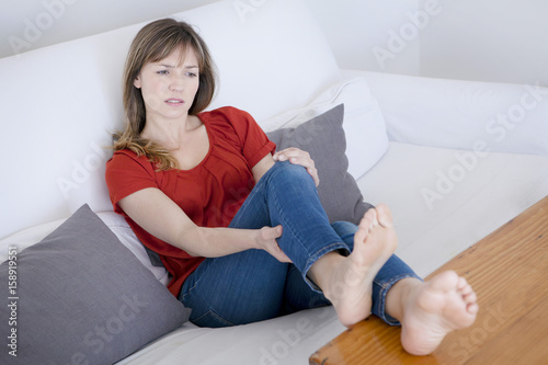 Woman suffering from leg pain