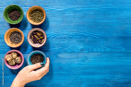 Photos Tea-party with different herbal tea on blue desk background flat lay mock up