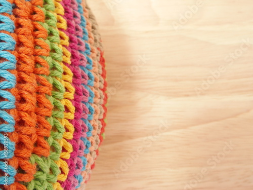 colorful crochet on parawood background photo