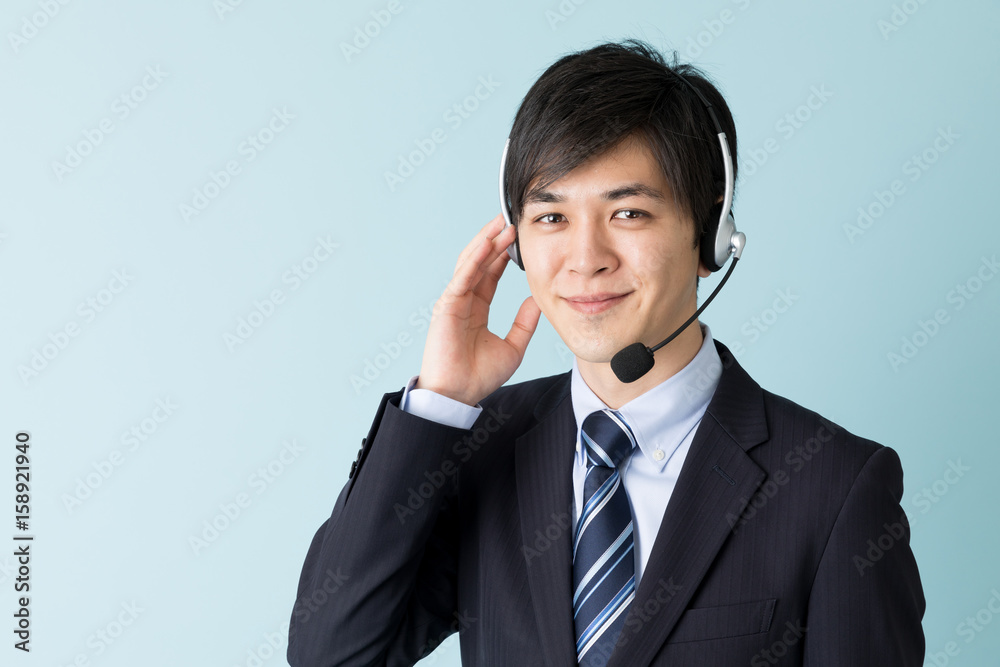 portrait of asian businessman isolated on blue background portrait of asian businessman isolated on blue background