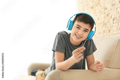 Teenager with headphones li...