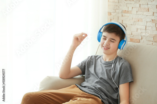 Teenager with headphones li...