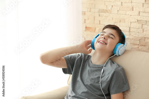 Teenager with headphones li...