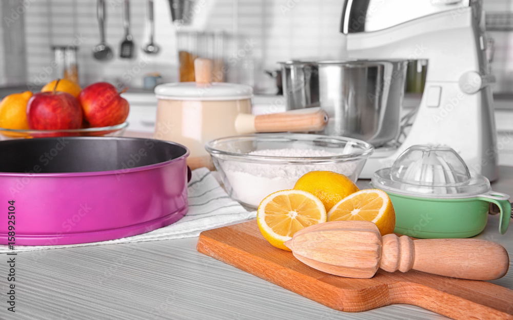 Kitchenware for cooking classes on wooden table Kitchenware for cooking classes on wooden table